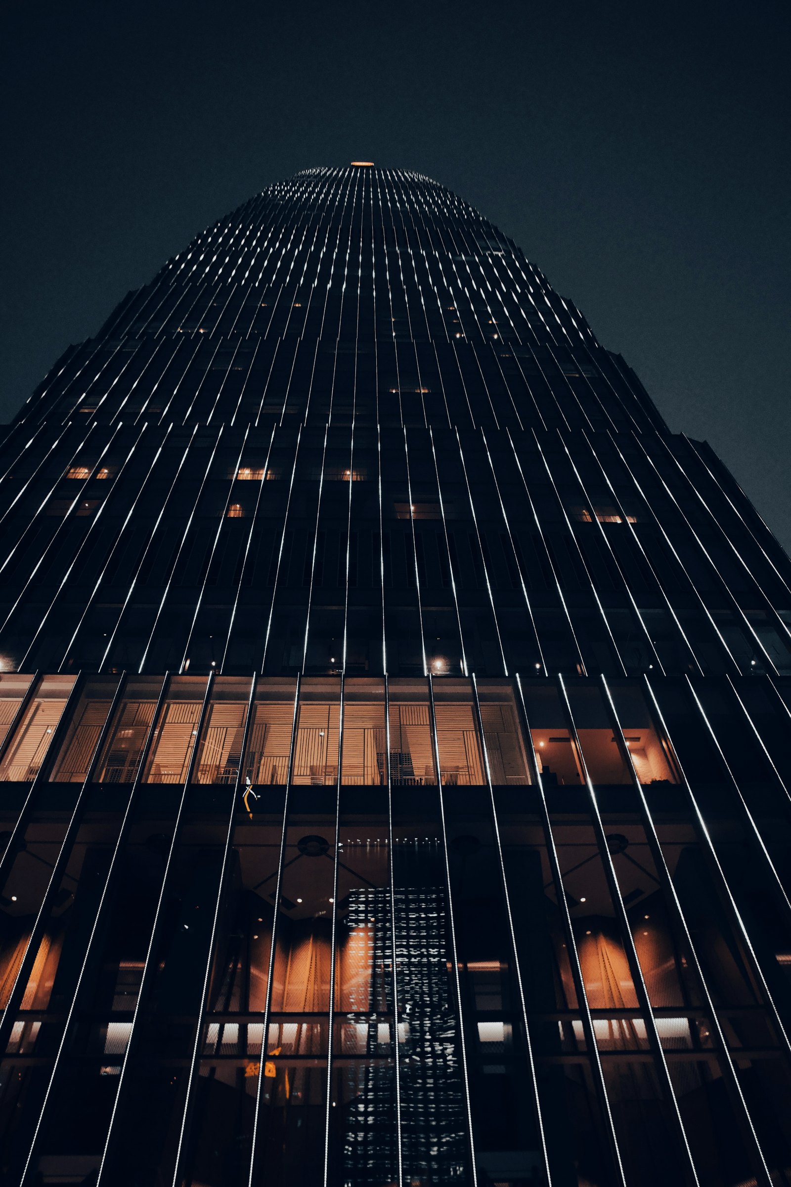 Office tower at night, seen from street level