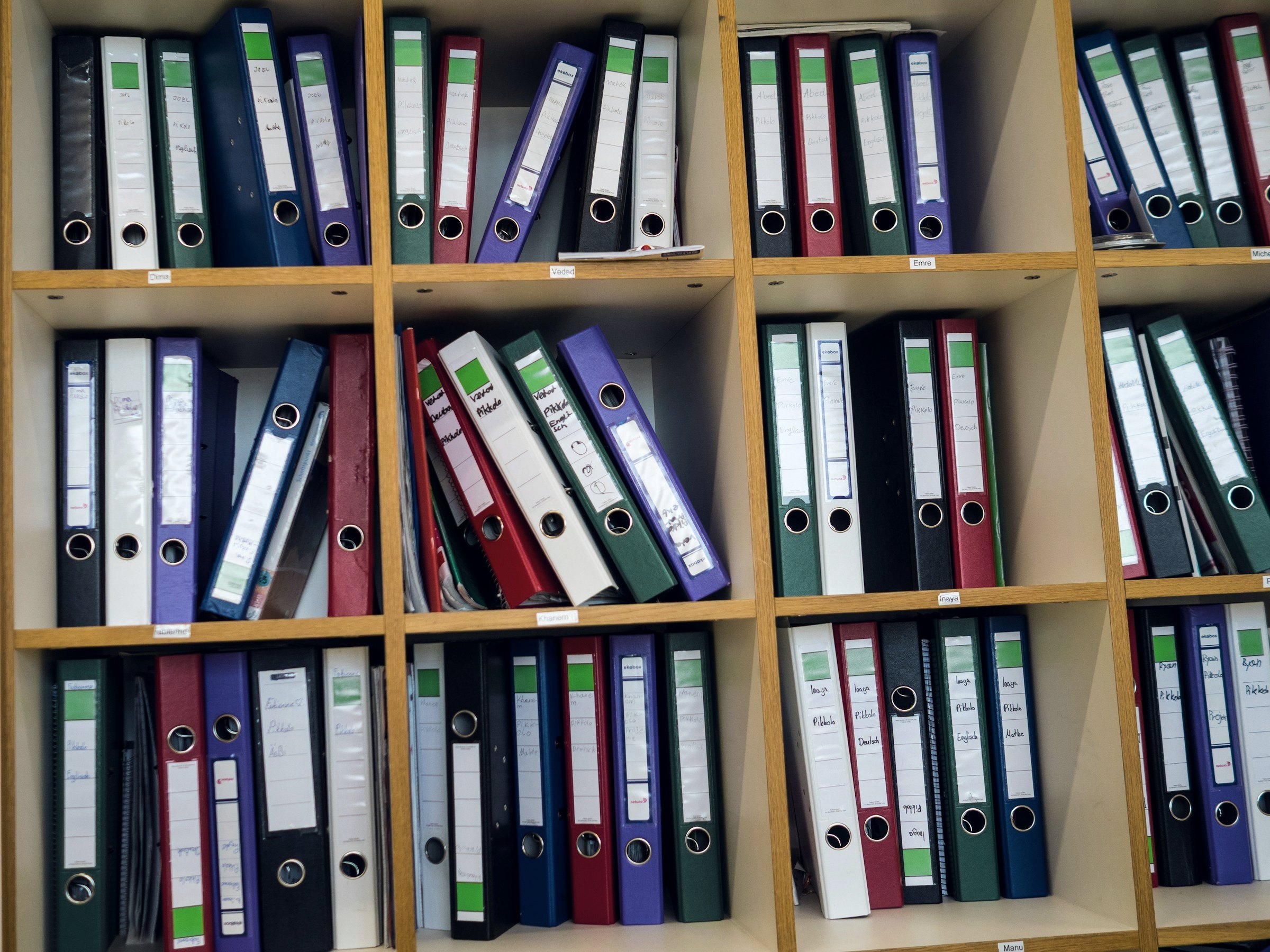 Shelves of labeled office binders