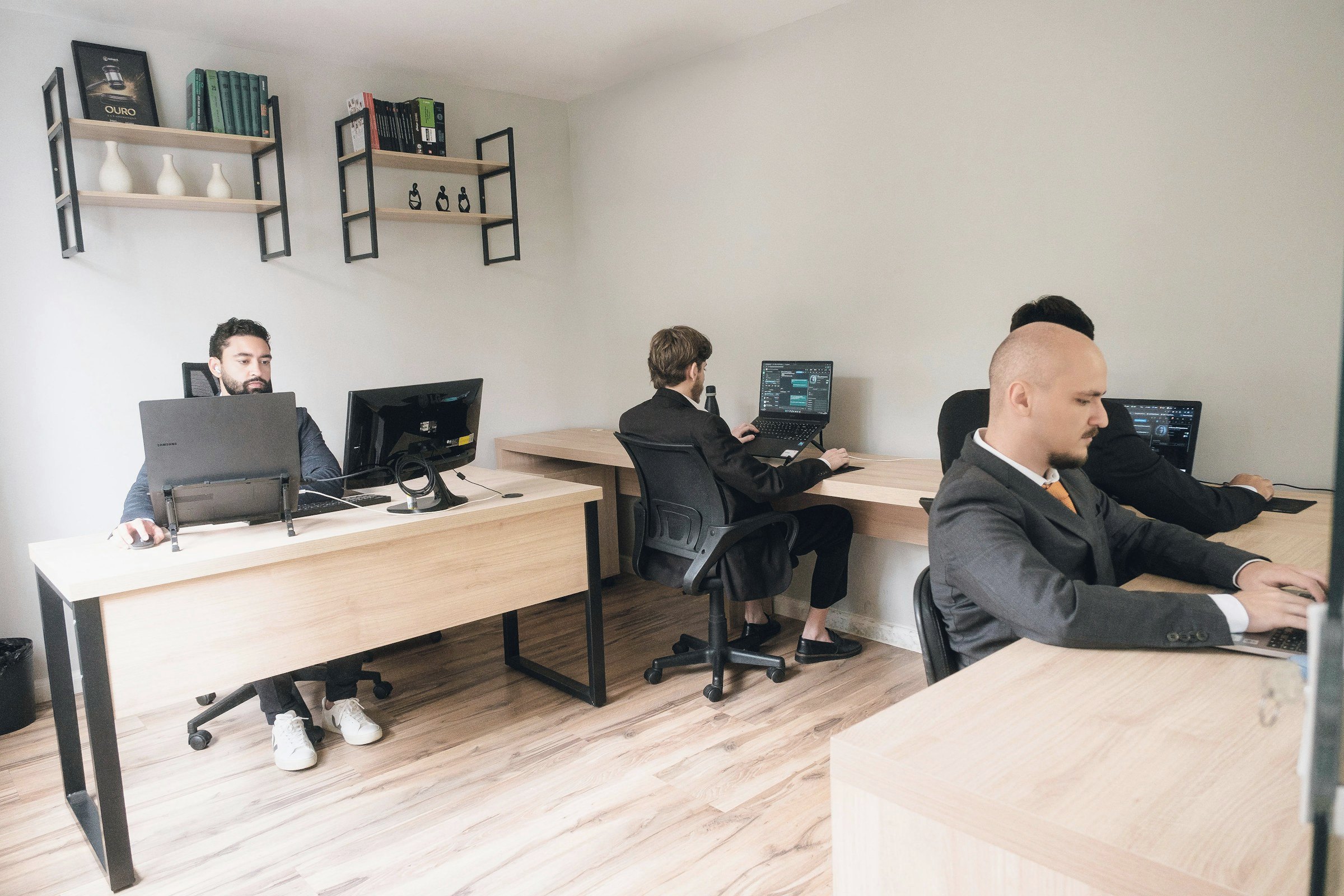 Colleagues working at desks in a bright office