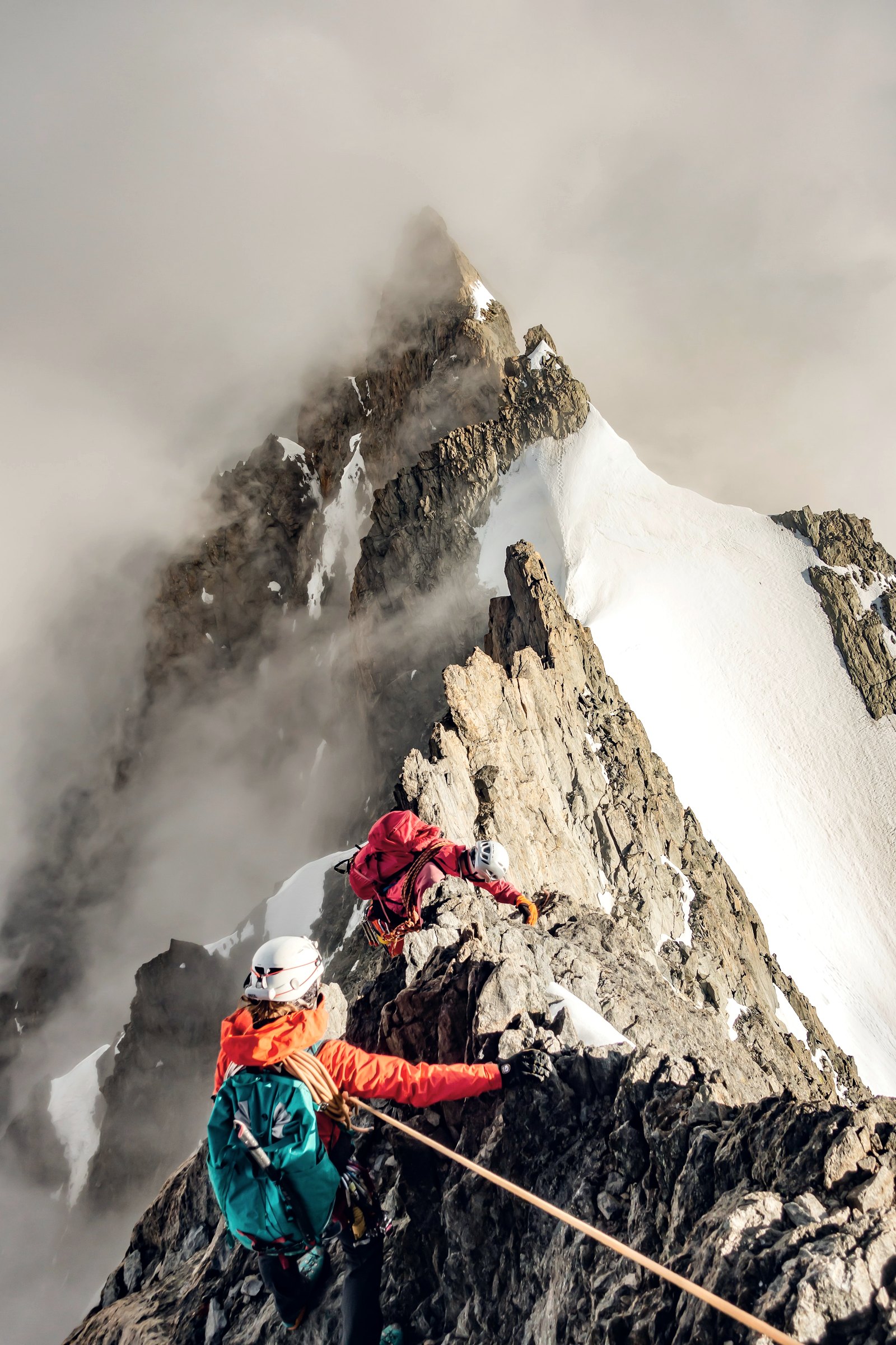 Climbers on a snowy mountain ridge