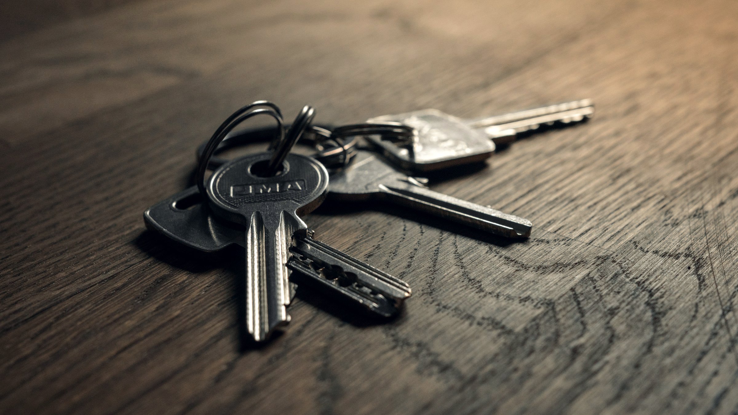 Set of keys on a wooden table
