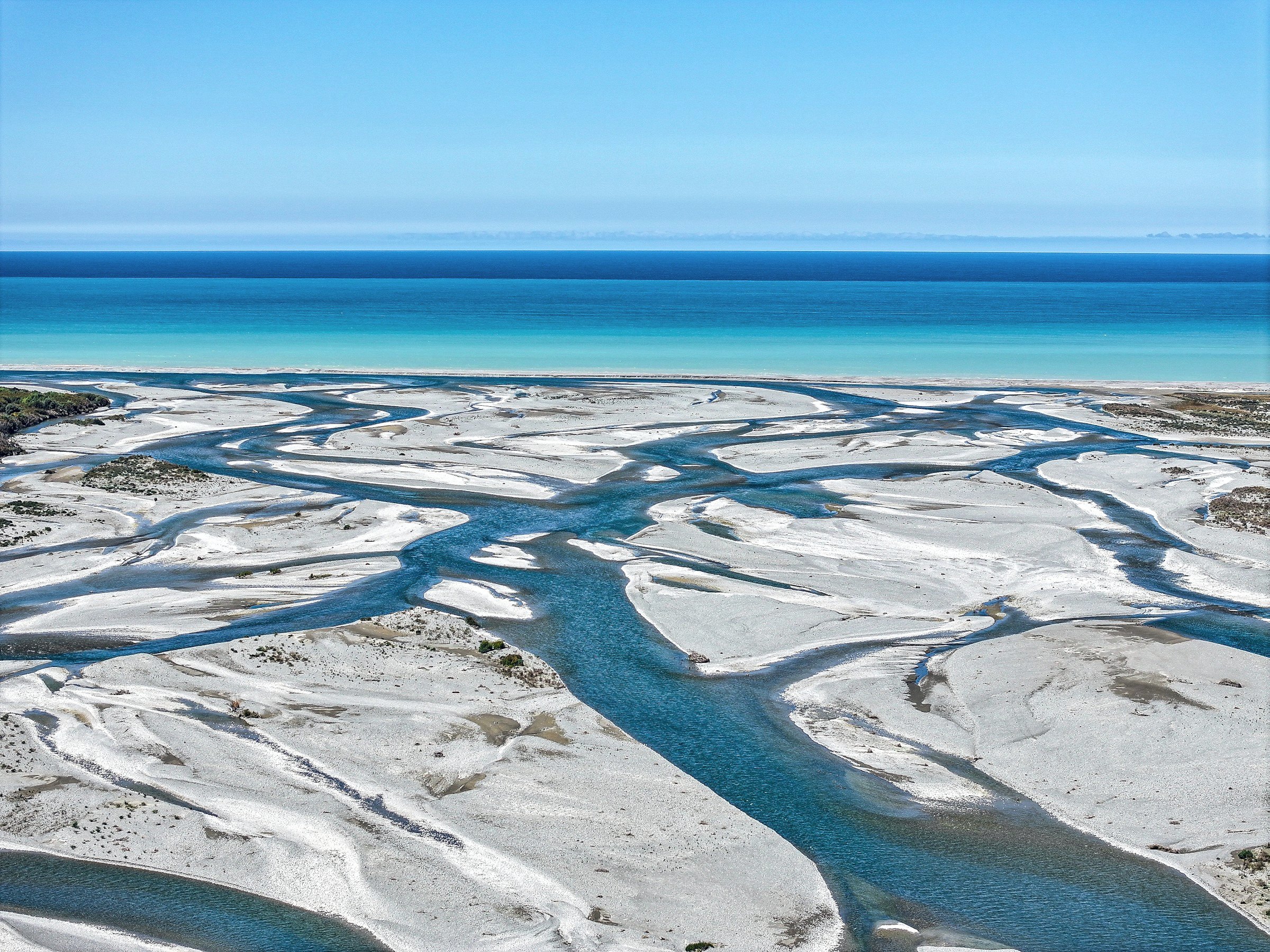 River channels running into the sea, seen from the air
